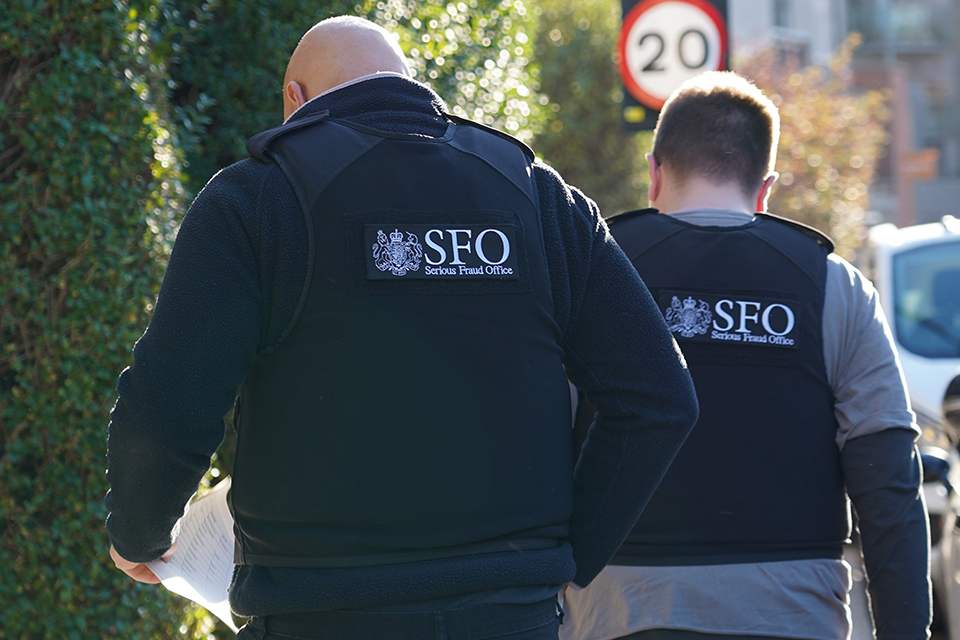 Serious Fraud Office investigators during a cryptocurrency fraud investigation